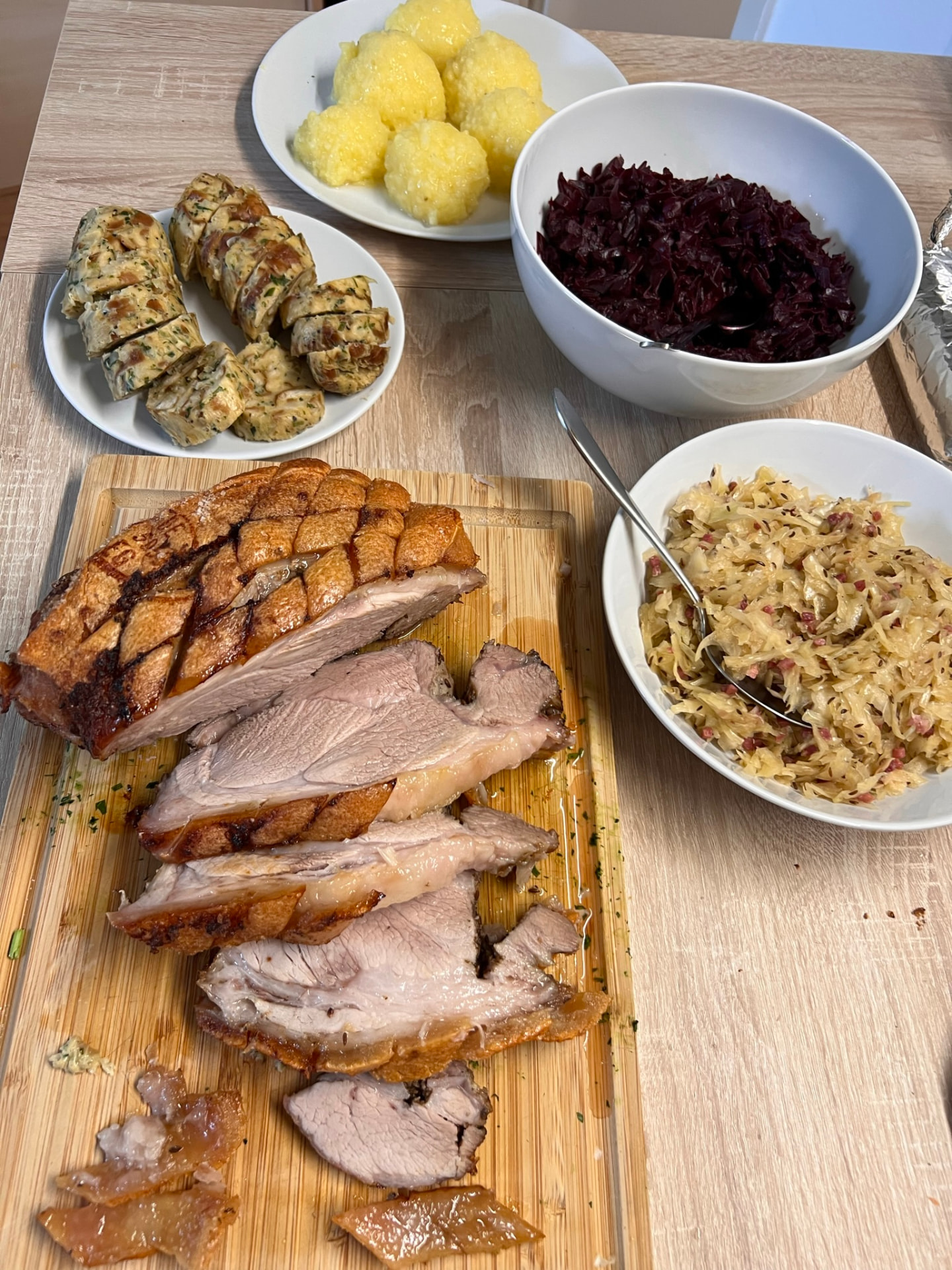 Bavarian roast pork with dumplings, red cabbage and sauerkraut